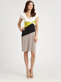 This clever colorblock design features an alluring surplice neckline attached to a flattering back tie.Surplice necklineShort sleevesPanel constructionBack tieAbout 26 from natural waist94% polyester/6% spandexDry cleanImportedModel shown is 5'11 (180cm) wearing US size Small. This clever colorblock design features an alluring surplice neckline attached to a flattering back tie.Surplice necklineShort sleevesPanel constructionBack tieAbout 26 from natural waist94% polyester/6% spandexDry cleanImportedModel shown is 5'11 (180cm) wearing US size Small.