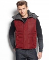 Boldly go nowhere without this bold hooded vest by Calvin Klein. This fitted vest will keep you warm while keeping your look hip and trendy.