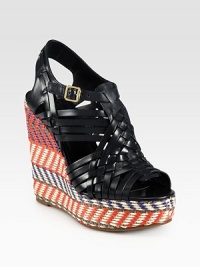A colorful raffia wedge lifts this sky-high design of woven leather, topped with an adjustable ankle strap. Raffia wedge, 5 (125mm)Raffia platform, 1¼ (30mm)Compares to a 3¾ heel (95mm)Leather upperAdjustable ankle strapLeather liningRubber solePadded insoleImported A colorful raffia wedge lifts this sky-high design of woven leather, topped with an adjustable ankle strap. Raffia wedge, 5 (125mm)Raffia platform, 1¼ (30mm)Compares to a 3¾ heel (95mm)Leather upperAdjustable ankle strapLeather liningRubber solePadded insoleImported