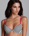 Calvin Klein's striped T-shirt bra lays flawlessly under most tops and even converts to criss-cross and halter for ultimate versatility. Style #F1026.