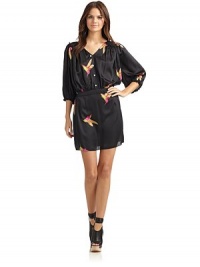 THE LOOKHummingbird print Pullover styleV-neckMock front buttonsThree-quarter length sleeves with elastic ruffled cuffs Ruffled shoulders and yokeGathered banded waist with elastic backTHE FITAbout 33 from shoulder to hemTHE MATERIALViscoseCARE & ORIGINDry cleanMade in USAModel shown is 5'10 (177cm) wearing US size Small. THE LOOKHummingbird print Pullover styleV-neckMock front buttonsThree-quarter length sleeves with elastic ruffled cuffs Ruffled shoulders and yokeGathered banded waist with elastic backTHE FITAbout 33 from shoulder to hemTHE MATERIALViscoseCARE & ORIGINDry cleanMade in USAModel shown is 5'10 (177cm) wearing US size Small.