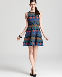 A bold geometric print imbues this Issa London knit dress with eclectic charm. A bold geometric print imbues this Issa London knit dress with eclectic charm.