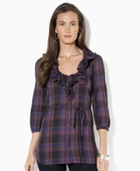 A bold plaid pattern sweeps across Lauren Jeans Co.'s chic cotton tunic, crafted with feminine ruffles at the neckline and three-quarter-length sleeves. (Clearance) A bold plaid pattern sweeps across Lauren Jeans Co.'s chic cotton tunic, crafted with feminine ruffles at the neckline and three-quarter-length sleeves. (Clearance)
