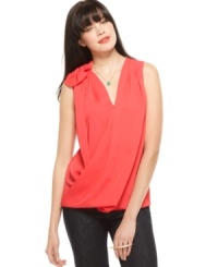 Decorated with a fabric flower, RACHEL Rachel Roy's top brings new life to a relaxed surplice silhouette. Decorated with a fabric flower, RACHEL Rachel Roy's top brings new life to a relaxed surplice silhouette.