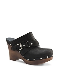 Boho clog meets bold, moto styling in this buckled-up UGG® Australia look. Boho clog meets bold, moto styling in this buckled-up UGG® Australia look.