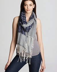 A stylish pairing of plaid and polka dot embellish this luxuriously soft scarf from Tory Burch. A stylish pairing of plaid and polka dot embellish this luxuriously soft scarf from Tory Burch.