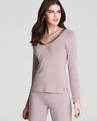 Update your lounge essentials with Calvin Klein Underwear's soft, satin-trimmed sleep shirt. Pair it with the coordinating pajama pants to complete the look. Update your lounge essentials with Calvin Klein Underwear's soft, satin-trimmed sleep shirt. Pair it with the coordinating pajama pants to complete the look.