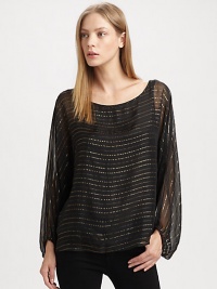 A billowy chiffon design mixes with edgy metallic stripes for stand-out style. BoatneckLong sheer dolman sleeves with elastic cuffsAbout 25 from shoulder to hem88% silk/12% metallic fibersDry cleanImportedModel shown is 5'9 (175cm) wearing US size Small.This style runs true to size. We recommend ordering your usual size for a standard fit. A billowy chiffon design mixes with edgy metallic stripes for stand-out style. BoatneckLong sheer dolman sleeves with elastic cuffsAbout 25 from shoulder to hem88% silk/12% metallic fibersDry cleanImportedModel shown is 5'9 (175cm) wearing US size Small.This style runs true to size. We recommend ordering your usual size for a standard fit.