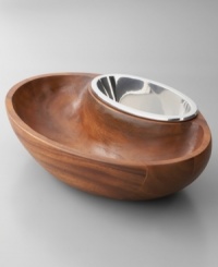 Serve casual snacks with the Dharma chip and dip, a modern beauty balancing carved wood and gleaming Nambé metal. Exterior and inset bowls share a sleek, oval silhouette and askew rims to showcase the delicious foods within. Coordinates with Dharma bowls and trays, also by Neil Cohen. Serve casual snacks with the Dharma chip and dip, a modern beauty balancing carved wood and gleaming Nambé metal. Exterior and inset bowls share a sleek, oval silhouette and askew rims to showcase the delicious foods within. Coordinates with Dharma bowls and trays, also by Neil Cohen.