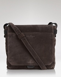 Rendered in supple suede for masculine polish, this refined messenger bag achieves the height of luxury with artisan craftsmanship and superior materials. Rendered in supple suede for masculine polish, this refined messenger bag achieves the height of luxury with artisan craftsmanship and superior materials.