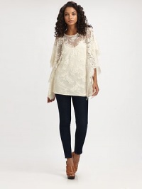 Timeless poncho softened by a ladylike lace silhouette. RoundneckLong poncho sleevesFully lined60% cotton/40% nylonHand washImportedModel shown is 5'9½ (176cm) wearing US size Small. Timeless poncho softened by a ladylike lace silhouette. RoundneckLong poncho sleevesFully lined60% cotton/40% nylonHand washImportedModel shown is 5'9½ (176cm) wearing US size Small.