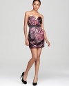A sweetheart of a dress featuring a flattering strapless silhouette and a beautiful rose-colored print.