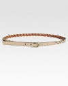 Luxe braided leather with a light gold spur buckle and engraved logo.About .6 wideMade in Italy 