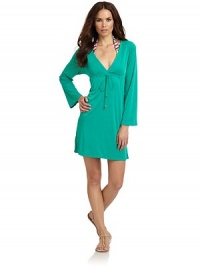 THE LOOKPlunging V-neckCinched waist with drawstring tie closureTHE FITAbout 33 from shoulder to hemTHE MATERIALNylonCARE & ORIGINHand washImported THE LOOKPlunging V-neckCinched waist with drawstring tie closureTHE FITAbout 33 from shoulder to hemTHE MATERIALNylonCARE & ORIGINHand washImported