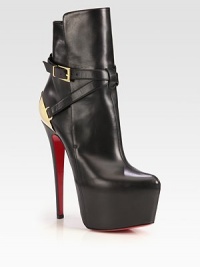 An exaggerated platform lifts this on-trend leather ankle boot, backed by a gleaming goldtone metal detail. Self-covered heel, 6¼ (160mm)Hidden platform, 2½ (65mm)Compares to a 3¾ heel (95mm)Leather and metal upperAdjustable buckle strapLeather liningSignature red leather solePadded insoleMade in Italy An exaggerated platform lifts this on-trend leather ankle boot, backed by a gleaming goldtone metal detail. Self-covered heel, 6¼ (160mm)Hidden platform, 2½ (65mm)Compares to a 3¾ heel (95mm)Leather and metal upperAdjustable buckle strapLeather liningSignature red leather solePadded insoleMade in Italy