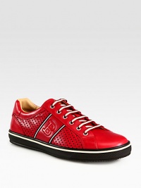 The essence of casual-cool, this low-cut sneaker is crafted from perforated and smooth leather with signature trainspotting side detail.Leather upperLeather liningPadded insoleRubber soleImported The essence of casual-cool, this low-cut sneaker is crafted from perforated and smooth leather with signature trainspotting side detail.Leather upperLeather liningPadded insoleRubber soleImported