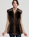 Add a luxe top layer to your look with this sumptuous faux fur anorak vest from Ellen Tracy.
