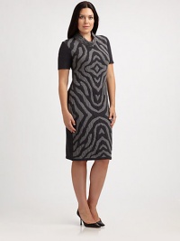 An undeniable head turner, this jersey dress features a zebra-print front. A touch of stretch ensures that you will love the way it fits you.Feminine necklineShort sleevesPrinted frontPull-on stylePrincess seams on backAbout 24 from natural waist95% wool/3% polyester/2% Lycra®Dry cleanMade in Italy