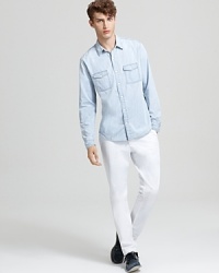 A refined work-shirt style from Vince, this faded denim sport shirt is rendered in a classic fit. A refined work-shirt style from Vince, this faded denim sport shirt is rendered in a classic fit.