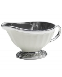 Gently scalloped silhouettes are carved of metal and enamel, creating serveware and serving dishes that embody graceful elegance. This charming gravy boat complements both Italian and French Countryside dinnerware from Mikasa. Gently scalloped silhouettes are carved of metal and enamel, creating serveware and serving dishes that embody graceful elegance. This charming gravy boat complements both Italian and French Countryside dinnerware from Mikasa.