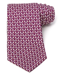 Slick dolphins do their tricks atop a classic silk tie from Salvatore Ferragamo. Slick dolphins do their tricks atop a classic silk tie from Salvatore Ferragamo.
