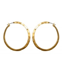 Hammered hoops make every day edgier. Kenneth Cole New York reinvents a classic with iridescent goldtone mixed metal and crystal accents. Approximate diameter: 3/4 inch.