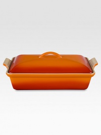 Crafted from heavy stoneware, Le Creuset cookware is the ultimate ingredient for chefs and home cooks worldwide. With its secure lid, this covered casserole is a convenient choice for transporting dishes to parties and picnics. Not only does the lid provide an effective moisture and heat lock for the dish, but it prevents spills and protects its contents.