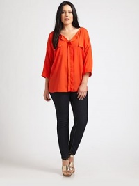 A silky blouse with a discreet button front and classic tailoring. Consider pairing it with bold earrings for a truly, head-turning look.Button frontThree-quarter sleevesPatch pocketsAbout 29 from shoulder to hemViscoseDry cleanImported A silky blouse with a discreet button front and classic tailoring. Consider pairing it with bold earrings for a truly, head-turning look.Button frontThree-quarter sleevesPatch pocketsAbout 29 from shoulder to hemViscoseDry cleanImported