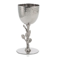Nature-inspired, Michael Aram's Botanical Leaf collection calls to mind the leaves and twisting branches of eucalyptus and seagrape. Artfully designed, this Kiddush cup makes an eye-catching centerpiece at seders or Friday night dinners. Nature-inspired, Michael Aram's Botanical Leaf collection calls to mind the leaves and twisting branches of eucalyptus and seagrape. Artfully designed, this Kiddush cup makes an eye-catching centerpiece at seders or Friday night dinners.