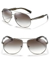 Keep it cool in Prada's sleek aviator sunglasses with double bridge design.