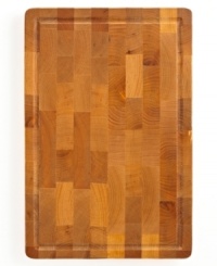 Do yourself a solid! Handcrafted from maple, this stunning cutting board ushers an all-natural elegance into your space. A smart design is easy on your cutlery and extremely durable for time after time of use. Do yourself a solid! Handcrafted from maple, this stunning cutting board ushers an all-natural elegance into your space. A smart design is easy on your cutlery and extremely durable for time after time of use.