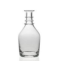 This elegant bottle-size carafe features chic ring details at the neck.
