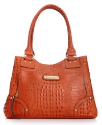 Franco Sarto brings a touch of the exotic to everyday accessorizing with this chic, croc-embossed design that goes from work to weekend in a wink. Accented with signature golden hardware and stud detailing, its pocket-lined interior keeps daytime essentials in place. Franco Sarto brings a touch of the exotic to everyday accessorizing with this chic, croc-embossed design that goes from work to weekend in a wink. Accented with signature golden hardware and stud detailing, its pocket-lined interior keeps daytime essentials in place.