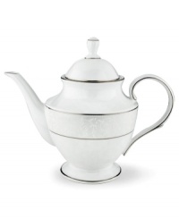 This elegant teapot is accented with a delicate flourish of vine-like, white-on-white imprints with raised, iridescent enamel dots. Holds 40 oz. From Lenox's dinnerware and dishes collection. This elegant teapot is accented with a delicate flourish of vine-like, white-on-white imprints with raised, iridescent enamel dots. Holds 40 oz. From Lenox's dinnerware and dishes collection.
