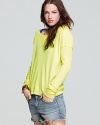Electrify your fall staples with this highlighter-bright Free People thermal top.