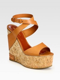 Italian leather straps surround an earthy cork wedge and platform. Cork and leather wedge, 5 (125mm)Cork platform, 2 (50mm)Compares to a 3 heel (75mm)Leather upperLeather liningRubber solePadded insoleMade in Spain Italian leather straps surround an earthy cork wedge and platform. Cork and leather wedge, 5 (125mm)Cork platform, 2 (50mm)Compares to a 3 heel (75mm)Leather upperLeather liningRubber solePadded insoleMade in Spain