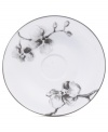 Compose a striking arrangement with the Black Orchid saucer by Michael Aram. Fine white Limoges porcelain flourishes under a dark watercolor motif inspired by foliage from around the world.