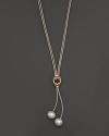 Freshwater pearls add rich luster to 14K yellow gold and leather. By Nancy B.