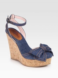 Secured by an adjustable ankle strap, this stretchy denim style is updated by a bow-adorned closed toe and cork wedge. Cork wedge, 5Cork platform, 2Compares to a 2 heelDenim upperDenim liningLeather solePadded insoleMade in ItalyOUR FIT MODEL RECOMMENDS ordering one half size up as this style runs small. 