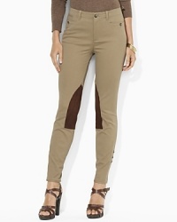 Inspired by classic equestrian styles, a stretch twill jodhpur is finished with faux-suede patches at the legs and button details at the cuffs. Inspired by classic equestrian styles, a stretch twill jodhpur is finished with faux-suede patches at the legs and button details at the cuffs.
