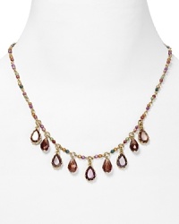 Strands of shimmering glass stones take on a new state of grace on this Lauren Ralph Lauren frontal drop necklace, set of by gleaming plated metal. Strands of shimmering glass stones take on a new state of grace on this Lauren Ralph Lauren frontal drop necklace, set of by gleaming plated metal.