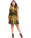 Sport a standout day to play look with Trixxi's short sleeve plus size dress, cinched by a banded waist.