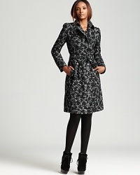 Burberry London puts a playful twist on the trench with a whimsical floral print for new-season flair. Burberry London puts a playful twist on the trench with a whimsical floral print for new-season flair.