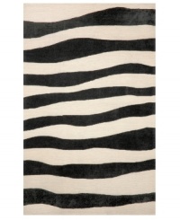 A suggested zebra stripe adds a hint of wild energy to the Spello Wavey Stripe area rug, while its tame color palette lends itself to any modern home décor. This unique home accent is intricately hand-tufted for crafted durability and supreme detailing in composition. A suggested zebra stripe adds a hint of wild energy to the Spello Wavey Stripe area rug, while its tame color palette lends itself to any modern home décor. This unique home accent is intricately hand-tufted for crafted durability and supreme detailing in composition.
