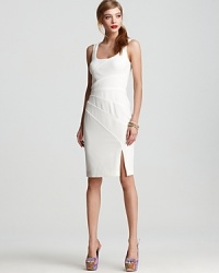 A flattering, formfitting silhouette infuses this bright white Black Halo sheath with sultry sophistication. A flattering, formfitting silhouette infuses this bright white Black Halo sheath with sultry sophistication.