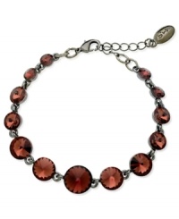 Circular chic. This bracelet from GUESS is crafted from hematite-tone mixed metal with amethyst glass crystal stones adding a vibrant touch. Item comes packaged in a signature GUESS Gift Box. Approximate length: 7-1/2 inches. Circular chic. This bracelet from GUESS is crafted from hematite-tone mixed metal with amethyst glass crystal stones adding a vibrant touch. Item comes packaged in a signature GUESS Gift Box. Approximate length: 7-1/2 inches.