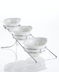 These Natura bowls from Godinger combine elegant white porcelain with chrome racks, ensuring your table is pretty but protected. Handles make things easier for the host. These Natura bowls from Godinger combine elegant white porcelain with chrome racks, ensuring your table is pretty but protected. Handles make things easier for the host.