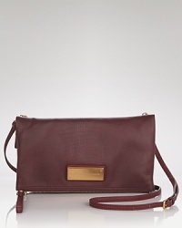 Things are never quite what they seem: A coolly styled, leather MARC BY MARC JACOBS clutch transforms into a sleek crossbody bag. Things are never quite what they seem: A coolly styled, leather MARC BY MARC JACOBS clutch transforms into a sleek crossbody bag.