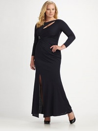 A daring slit and cutout neckline meet sparkling rhinestone trim to create an unforgettably dramatic look. Boatneck Three quarter sleeves Cutout neckline Rhinestone trim Side slit Fully lined About 44 from shoulder to hem Rayon Dry clean Made in the USA of imported fabric A daring slit and cutout neckline meet sparkling rhinestone trim to create an unforgettably dramatic look. Boatneck Three quarter sleeves Cutout neckline Rhinestone trim Side slit Fully lined About 44 from shoulder to hem Rayon Dry clean Made in the USA of imported fabric