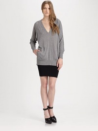 Ultra-light wool in a slouchy-chic silhouette with a plunging v-neck, long dolman sleeves and slash pockets. V-neckLong dolman sleevesSlash pocketsLonger length hits below the hipsWoolDry cleanImported of Italian fabricModel shown is 5'10 (177cm) wearing US size Small. Ultra-light wool in a slouchy-chic silhouette with a plunging v-neck, long dolman sleeves and slash pockets. V-neckLong dolman sleevesSlash pocketsLonger length hits below the hipsWoolDry cleanImported of Italian fabricModel shown is 5'10 (177cm) wearing US size Small.